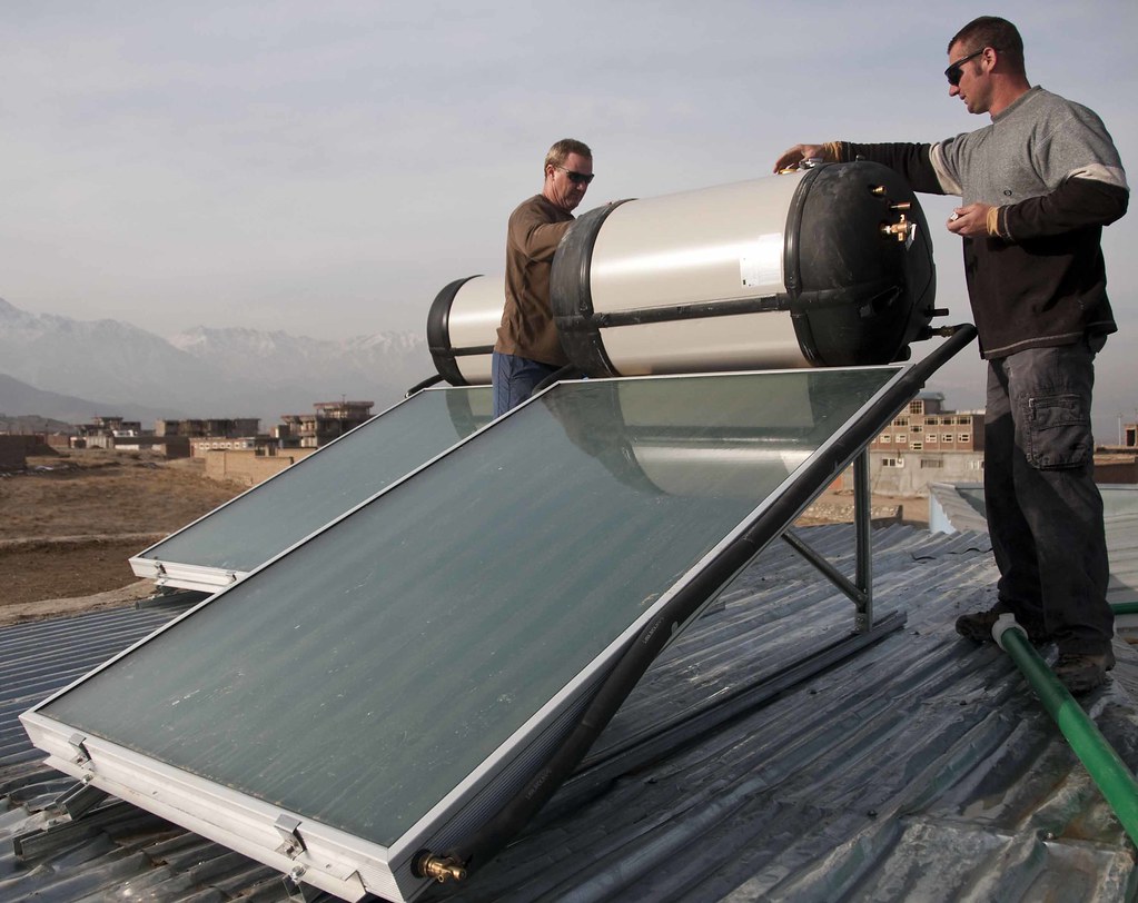 Solar hot water system installation on a rooftop
